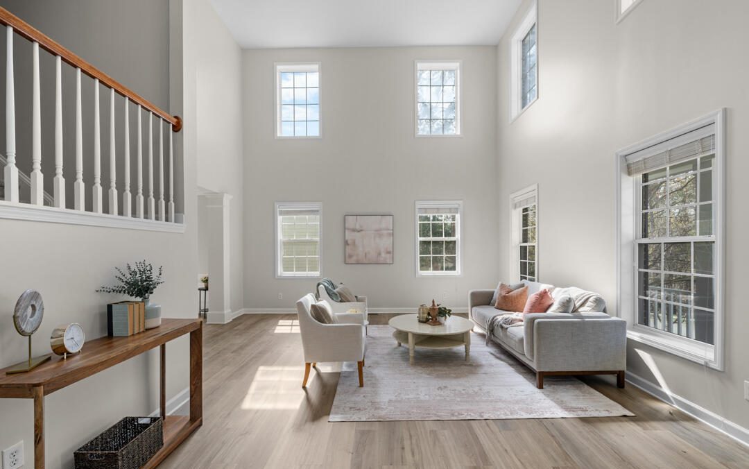 Warm white wall with oak picture rail and natural linen drapery